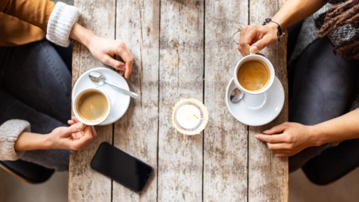 Two people meeting over coffee